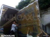/dateien/uh55144,1253346186,largepaintinggoinmg into movingtruck
