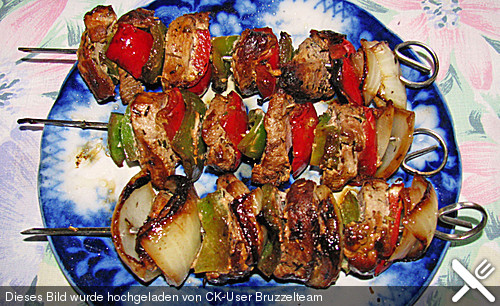 346875 big schweinespiess an safranreis.