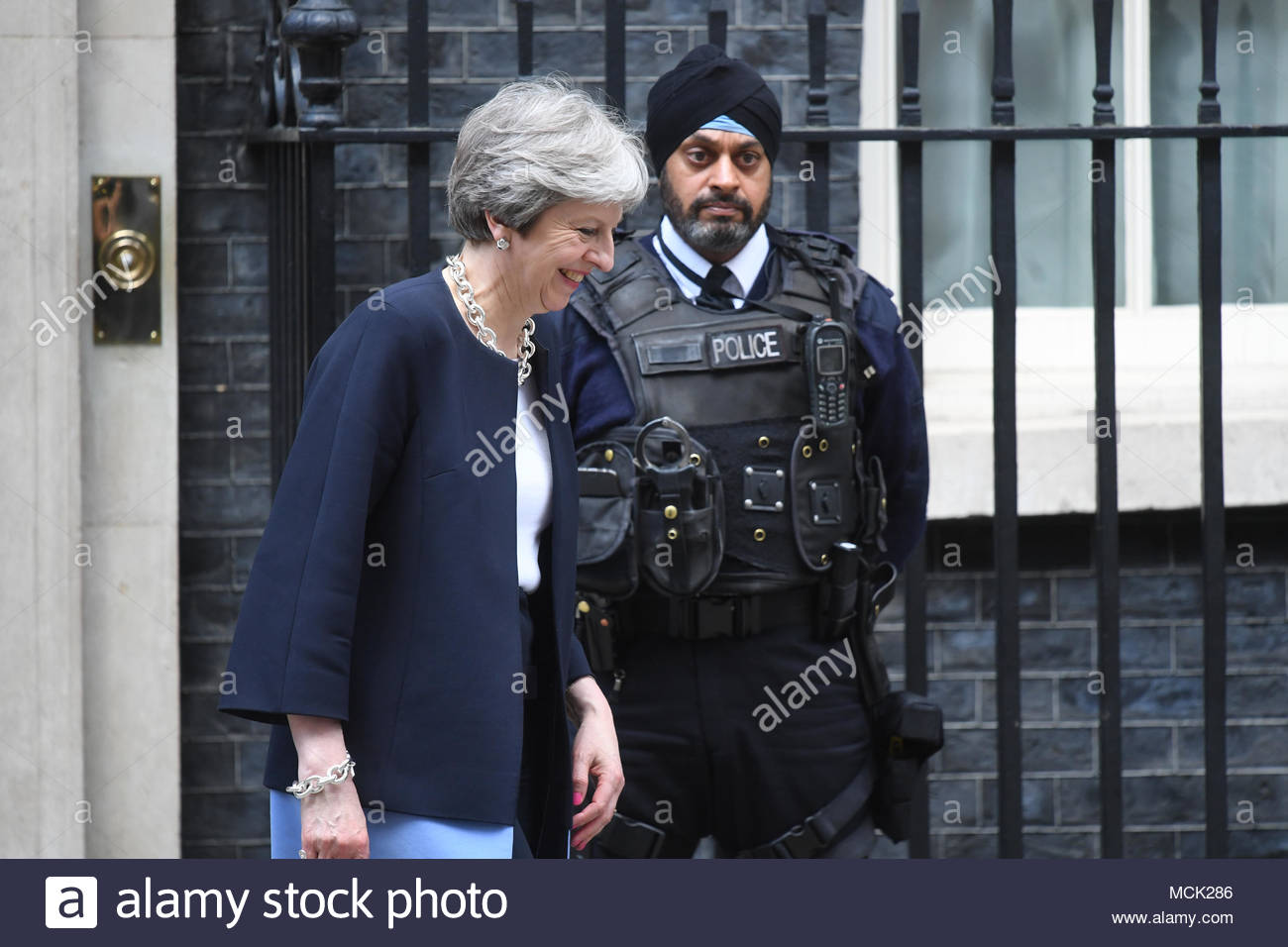 theresa-may-passes-a-sikh-policeman-on-g