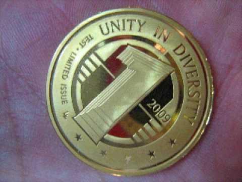 Youtube: Medvedev Shows Off Sample Coin of New World Currency At G8